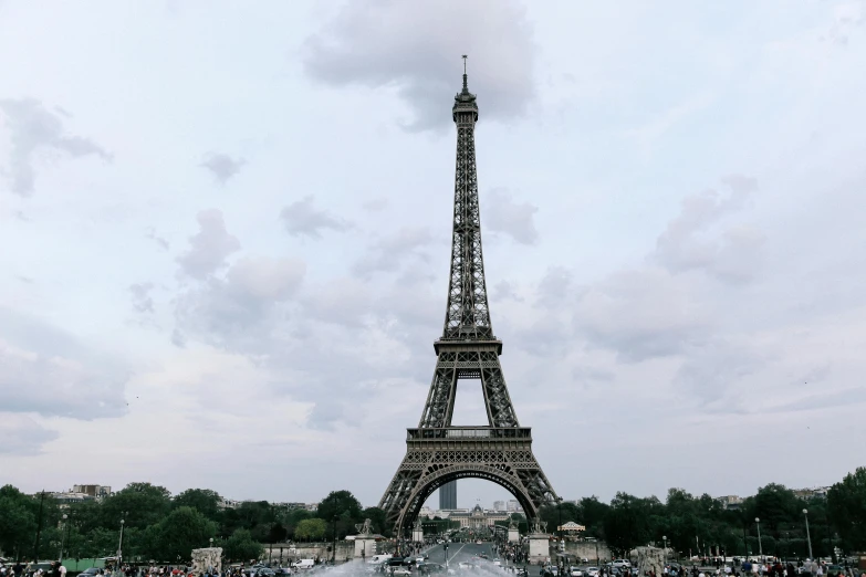 a group of people standing around a fountain in front of the eiffel tower, pexels contest winner, visual art, grey cloudy skies, hd footage, stacked image, neoclassical tower with dome