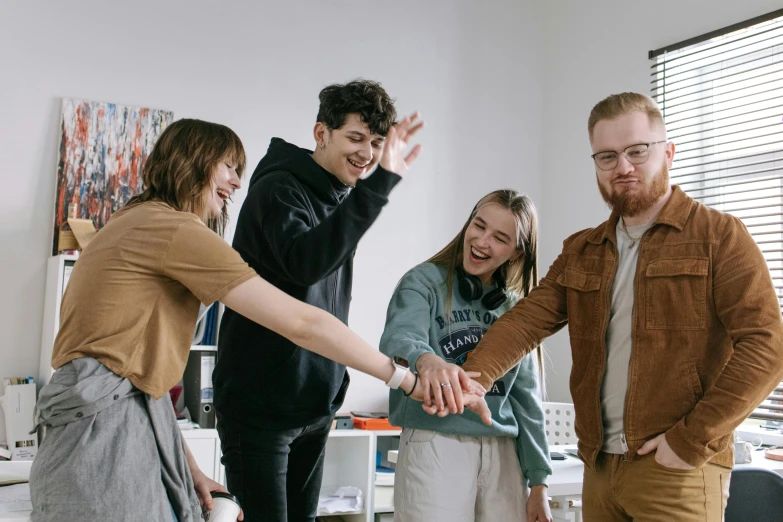 a group of people holding hands in a room, casual pose, playing games, artsationhq, student