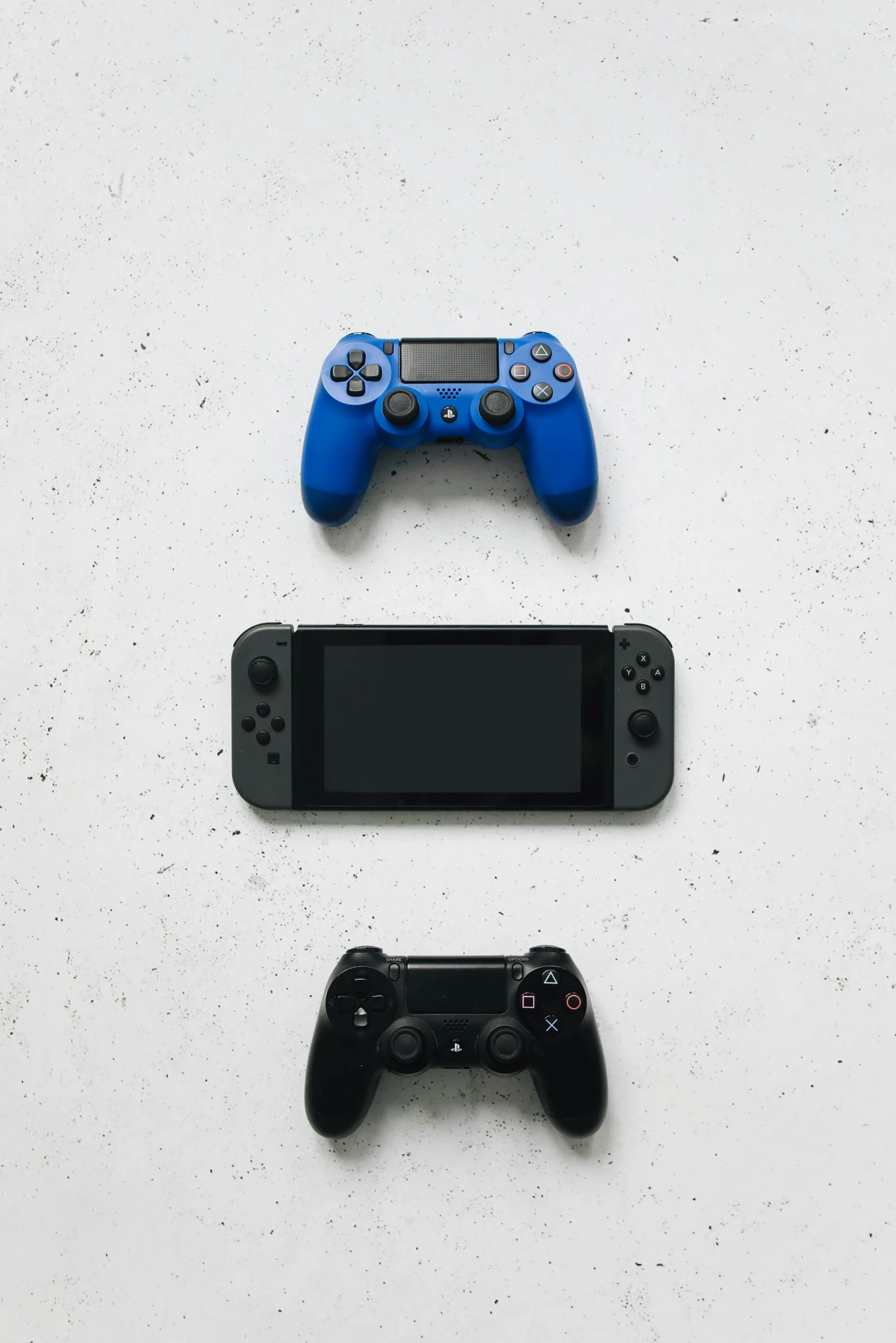 a couple of video game controllers next to a cell phone, minimalism, shot with sony alpha 1 camera, blue-black, uploaded, switch