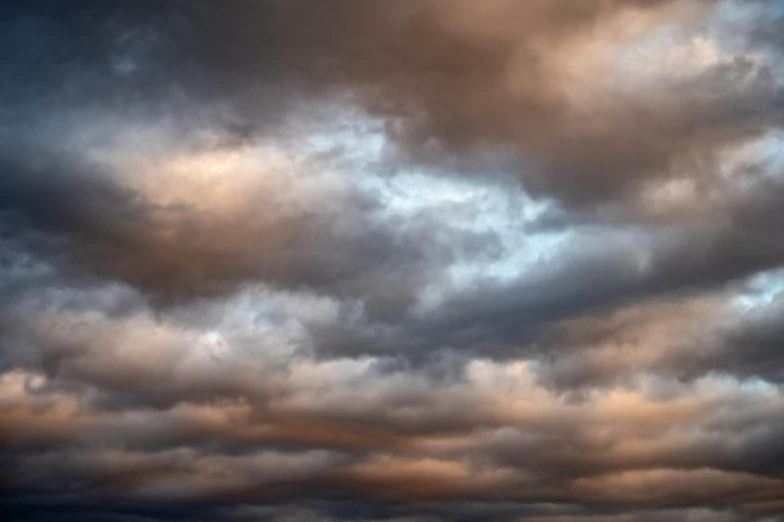 a large body of water under a cloudy sky, pexels contest winner, tonalism, mammatus clouds, multicoloured, dynamic sky, dramatic light 8 k