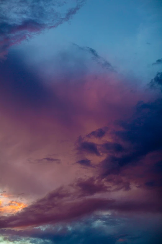 a plane that is flying in the sky, a portrait, by Sven Erixson, romanticism, second colours - purple, beautiful new mexico sunset, atmospheric photograph, after the storm