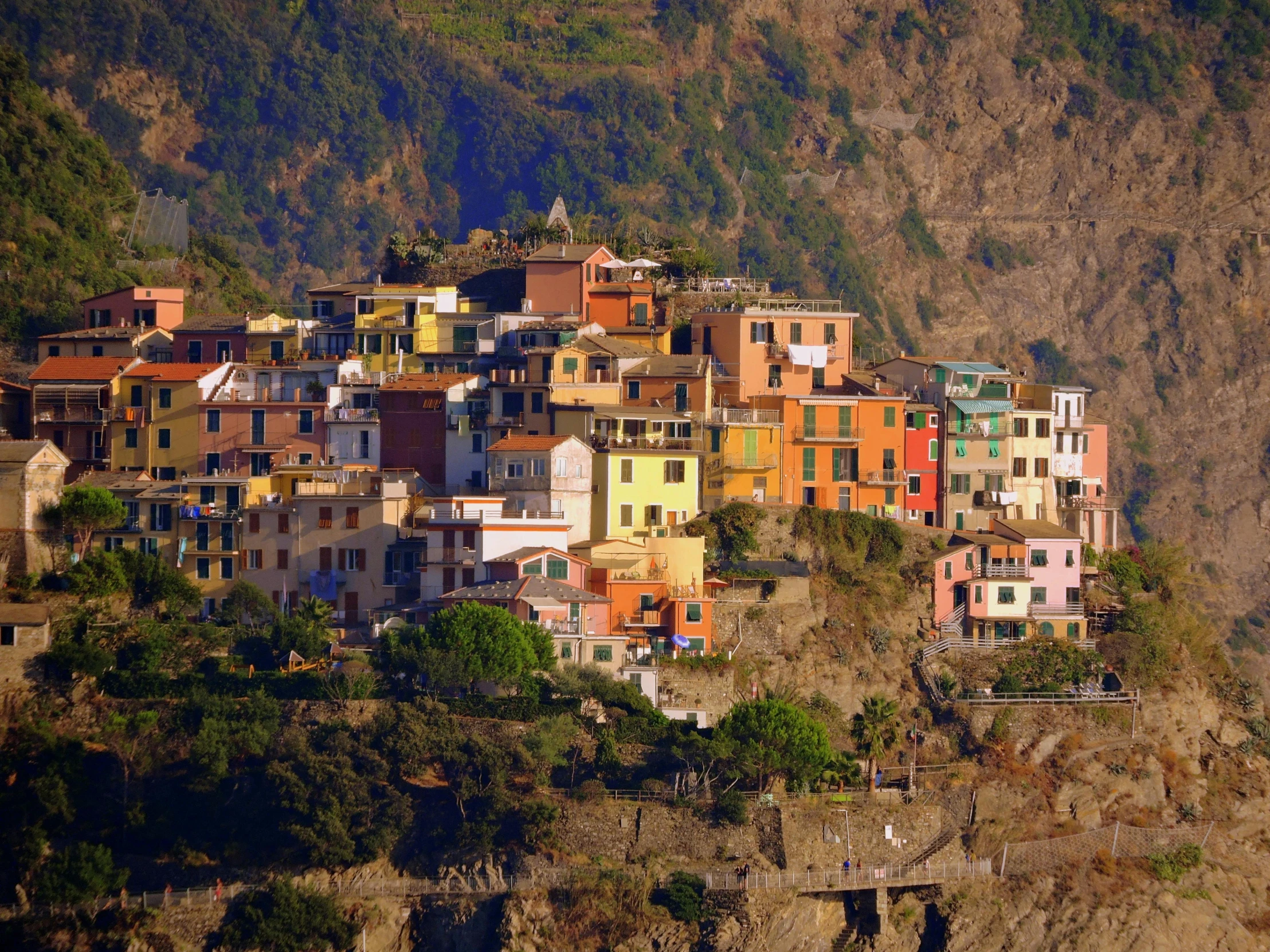 a group of buildings sitting on top of a cliff, by Carlo Martini, pexels contest winner, renaissance, colorful”, avatar image, small port village, profile image