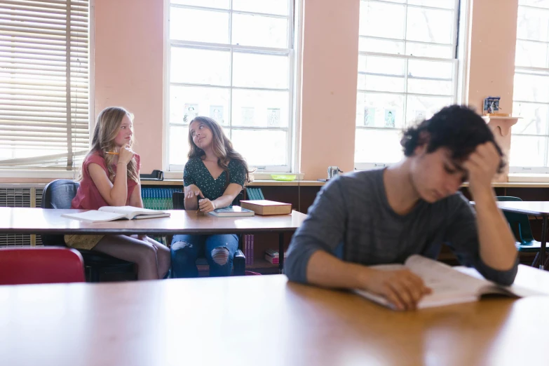 a group of people sitting at desks in a classroom, a photo, by Nina Hamnett, academic art, background image, profile image