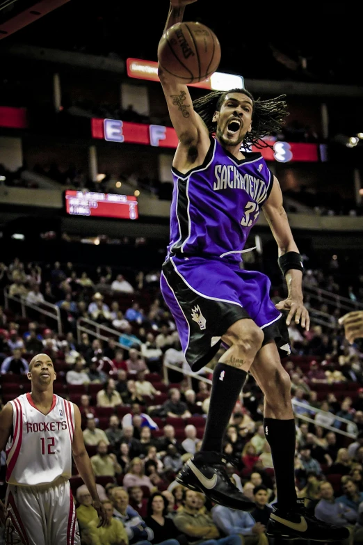 a man that is jumping in the air with a basketball, by Greg Rutkowski, happening, purple and black clothes, wearing nba jersey, upset, taken in the late 2010s