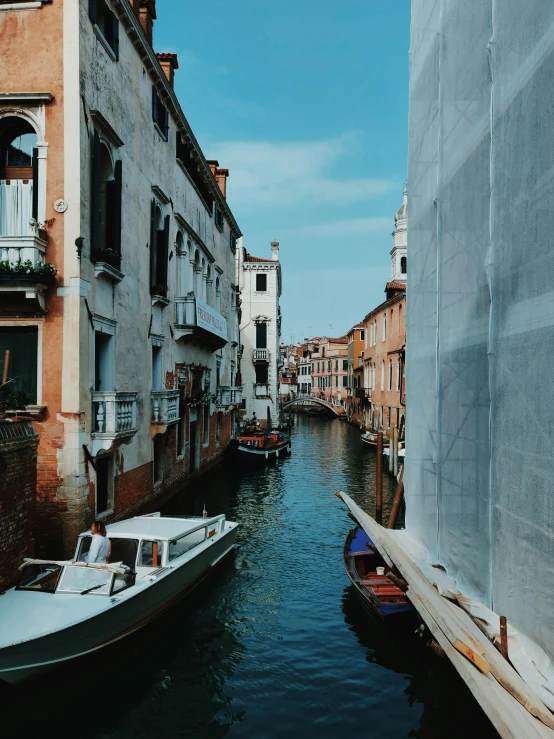 a couple of boats that are in the water, inspired by Quirizio di Giovanni da Murano, pexels contest winner, river flowing through a wall, trending on vsco, shady alleys, thumbnail