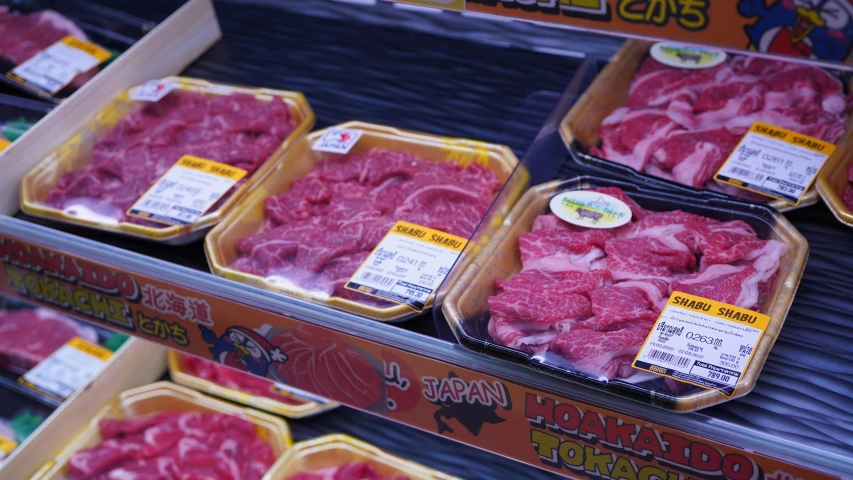 a display in a grocery store filled with meat, a picture, pexels, shin hanga, close up iwakura lain, grey, brown, steak