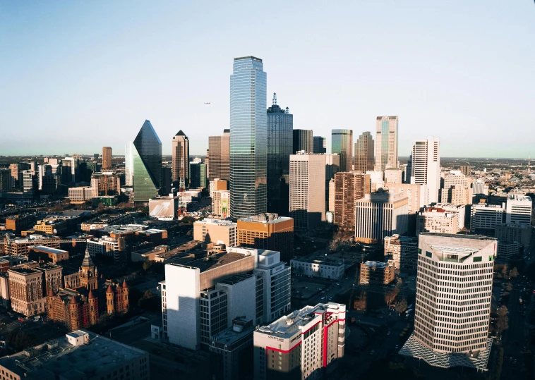 a view of a city from the top of a building, by Austin English, pexels contest winner, high rise skyscrapers, low detailed, tx, view from helicopter