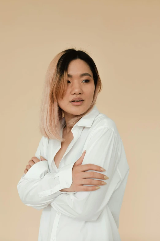 a woman with pink hair wearing a white shirt, inspired by Ruth Jên, trending on pexels, realism, wear's beige shirt, asian descent, ombre, confident relaxed pose