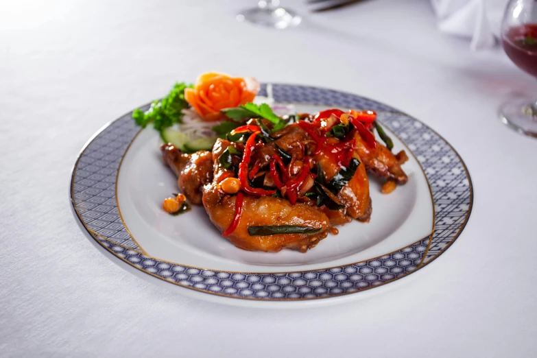 a close up of a plate of food on a table, inspired by Li Kan, unsplash, cloisonnism, jet wings on the back, beijing, chicken, high resolution product photo