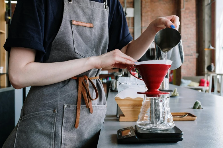 a woman in an apron pours a cup of coffee, by Julia Pishtar, trending on unsplash, blue and red color scheme, cone shaped, close up iwakura lain, 🦩🪐🐞👩🏻🦳