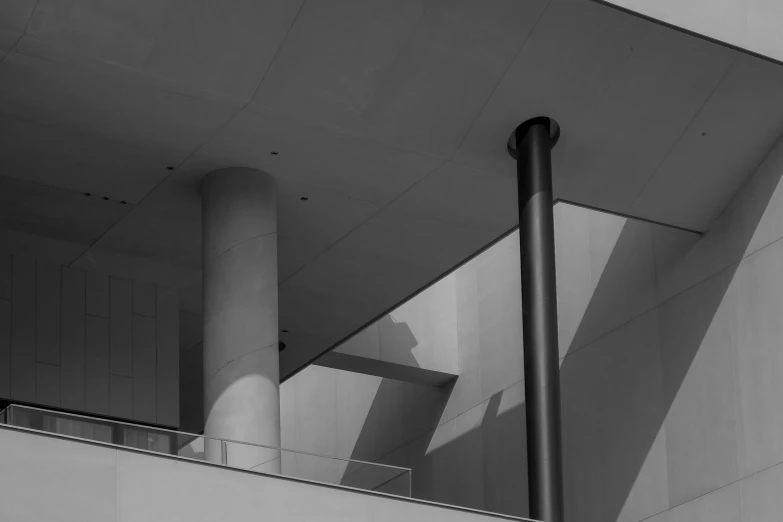 a black and white photo of a building, by Michalis Oikonomou, unsplash, minimalism, morphosis, morning detail, museum of modern art, concrete balcony