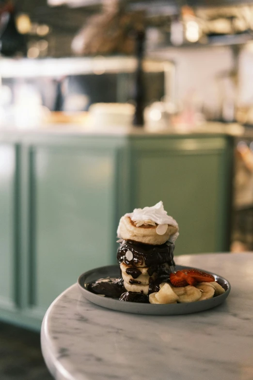 a close up of a plate of food on a table, a portrait, inspired by Richmond Barthé, trending on unsplash, chocolate sauce, stacked, bakery, medium shot taken from behind