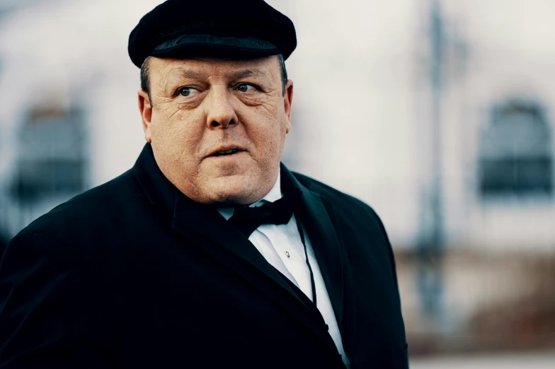 a close up of a person wearing a suit and hat, inspired by Winston Churchill, slide show, colour photograph, john candy, abcdefghijklmnopqrstuvwxyz