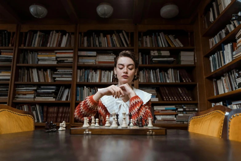 a woman playing a game of chess in a library, a portrait, by Emma Andijewska, pexels contest winner, 15081959 21121991 01012000 4k, model posing, thumbnail, multiple stories