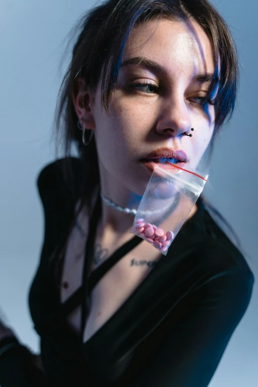 a woman brushing her teeth with a toothbrush, an album cover, inspired by Elsa Bleda, trending on pexels, antipodeans, wearing choker, full of glass. cgsociety, lil peep, eating