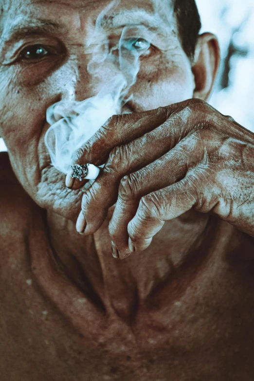 a close up of a person smoking a cigarette, by Matija Jama, pexels contest winner, grandfatherly, holding his hands up to his face, pot, wrinkles and muscle tissues