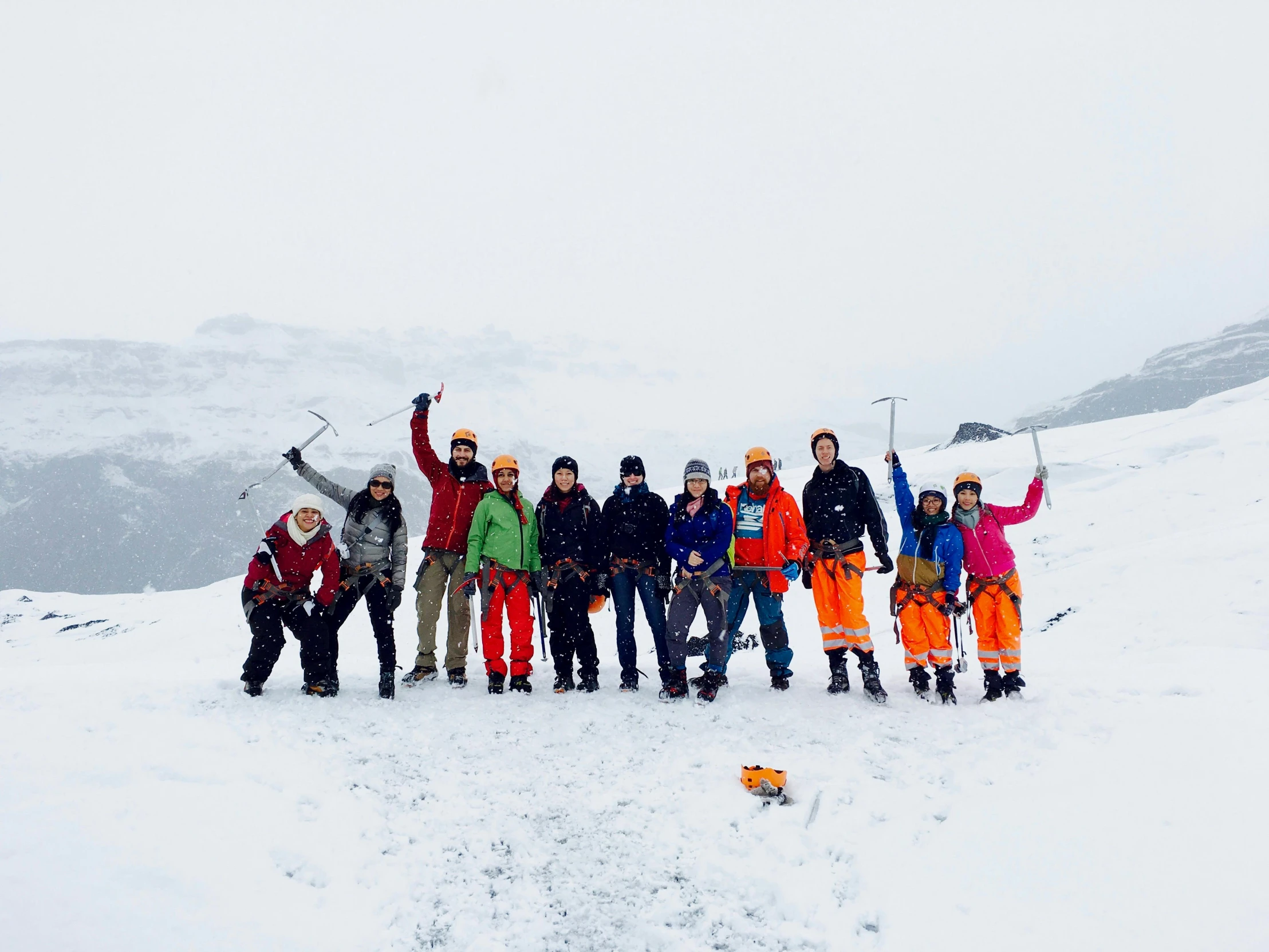 a group of people standing on top of a snow covered slope, wearing adventure gear, avatar image, belaying, group photo