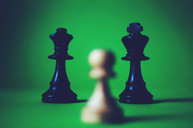 two chess pieces facing each other on a green background, an album cover, by Jesper Knudsen, unsplash, ((sharp focus)), oppression, rule of three, 15081959 21121991 01012000 4k