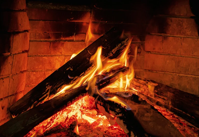 a close up of a fire in a fireplace, an album cover, pexels, multiple stories, brown, pyromallis, hot food