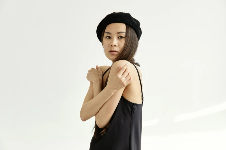 a woman in a black dress and a black hat, inspired by Kim Tschang Yeul, wearing a french beret, she is wearing a black tank top, japanese collection product, arms to side