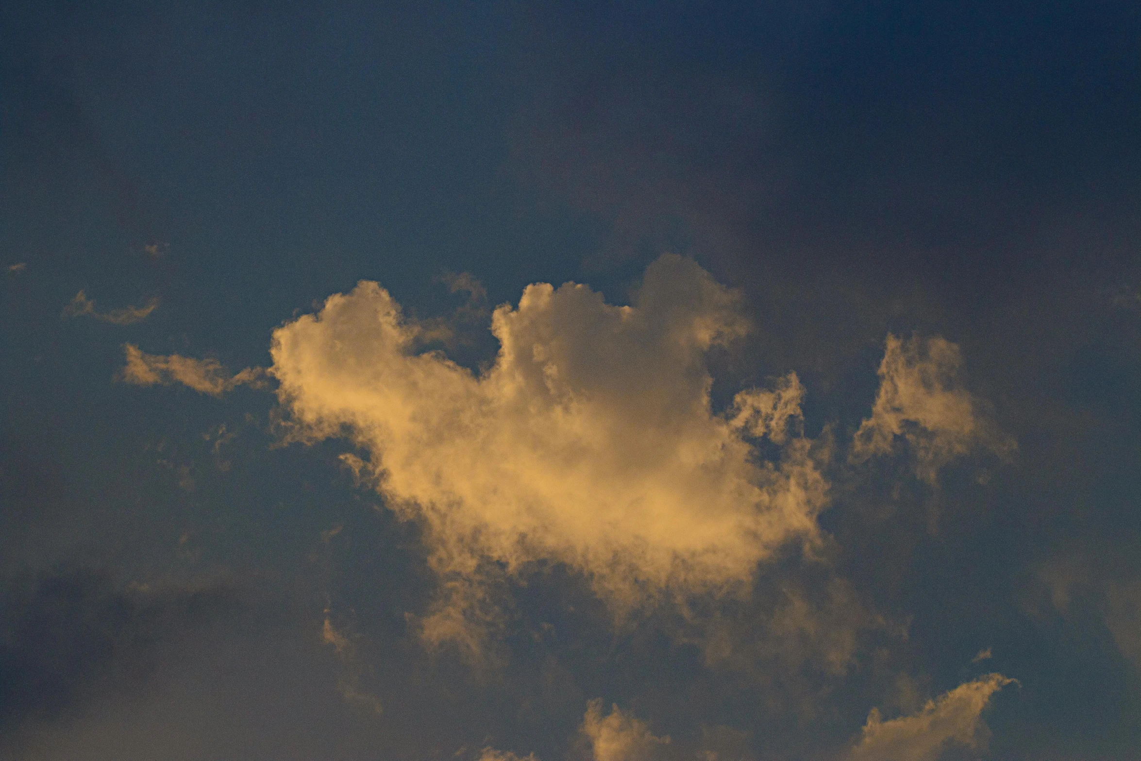 a plane flying through a cloudy blue sky, by Jan Rustem, unsplash, romanticism, evening sunlight, cumulus, color photograph, ignant