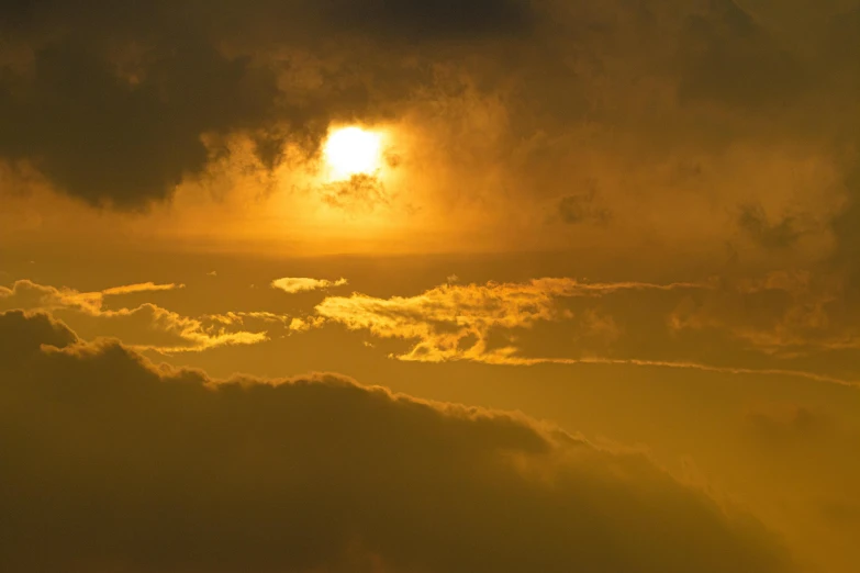 a large jetliner flying through a cloudy sky, by Jan Tengnagel, pexels contest winner, romanticism, an expansive view of the sun, yellow, sunset kanagawa prefecture, today\'s featured photograph 4k