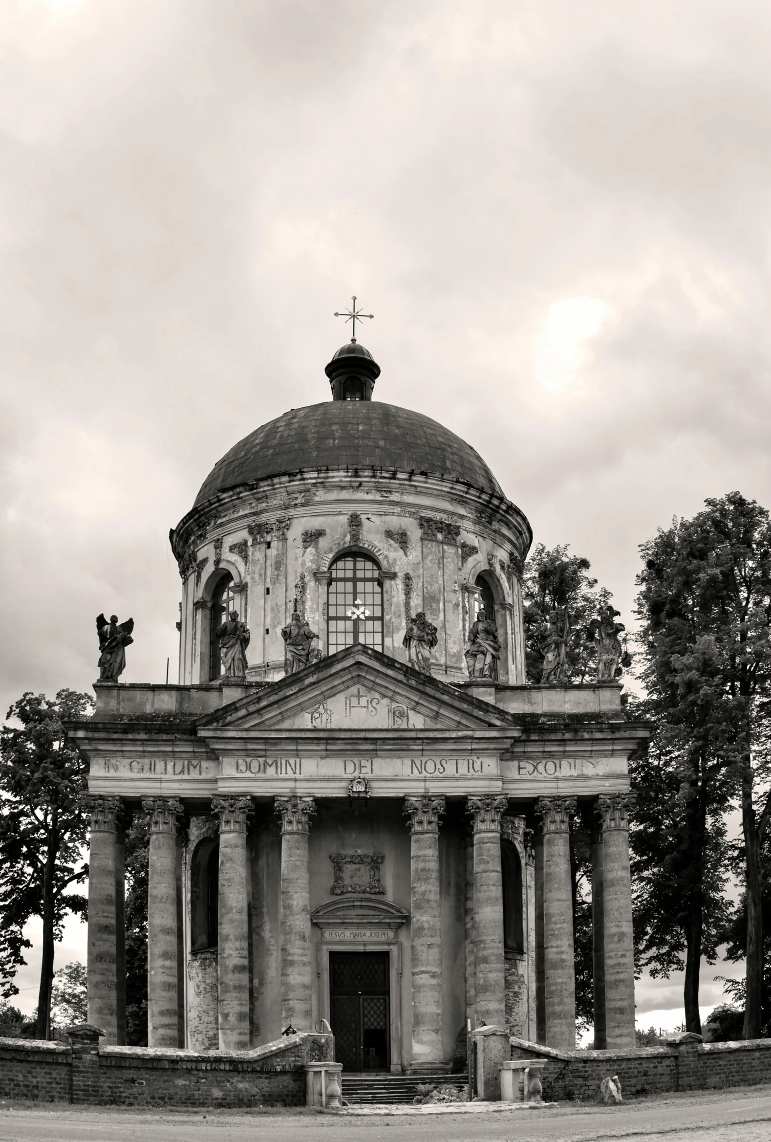 a black and white photo of a church, inspired by Abraham van den Tempel, neoclassicism, rotunda, tula, summer evening, cementary of skulls