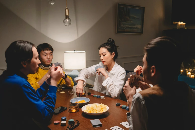 a group of people sitting around a wooden table, pexels contest winner, hyperrealism, card game, avatar image, evening time, qiu fang