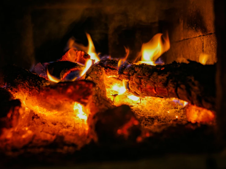 a close up of a fire in a fireplace, pexels contest winner, warm glow coming the ground, profile image, thumbnail, fire and ice