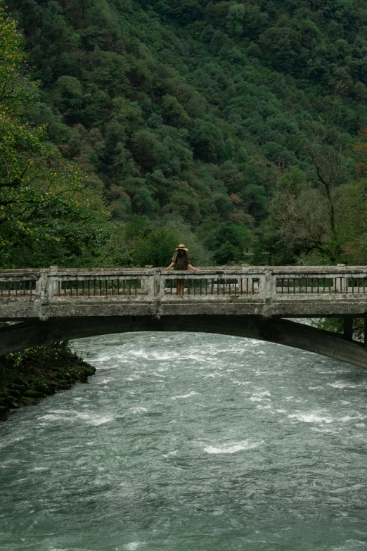 a man walking across a bridge over a river, a picture, inspired by Karl Stauffer-Bern, renaissance, alessio albi, chile, bench, a cozy