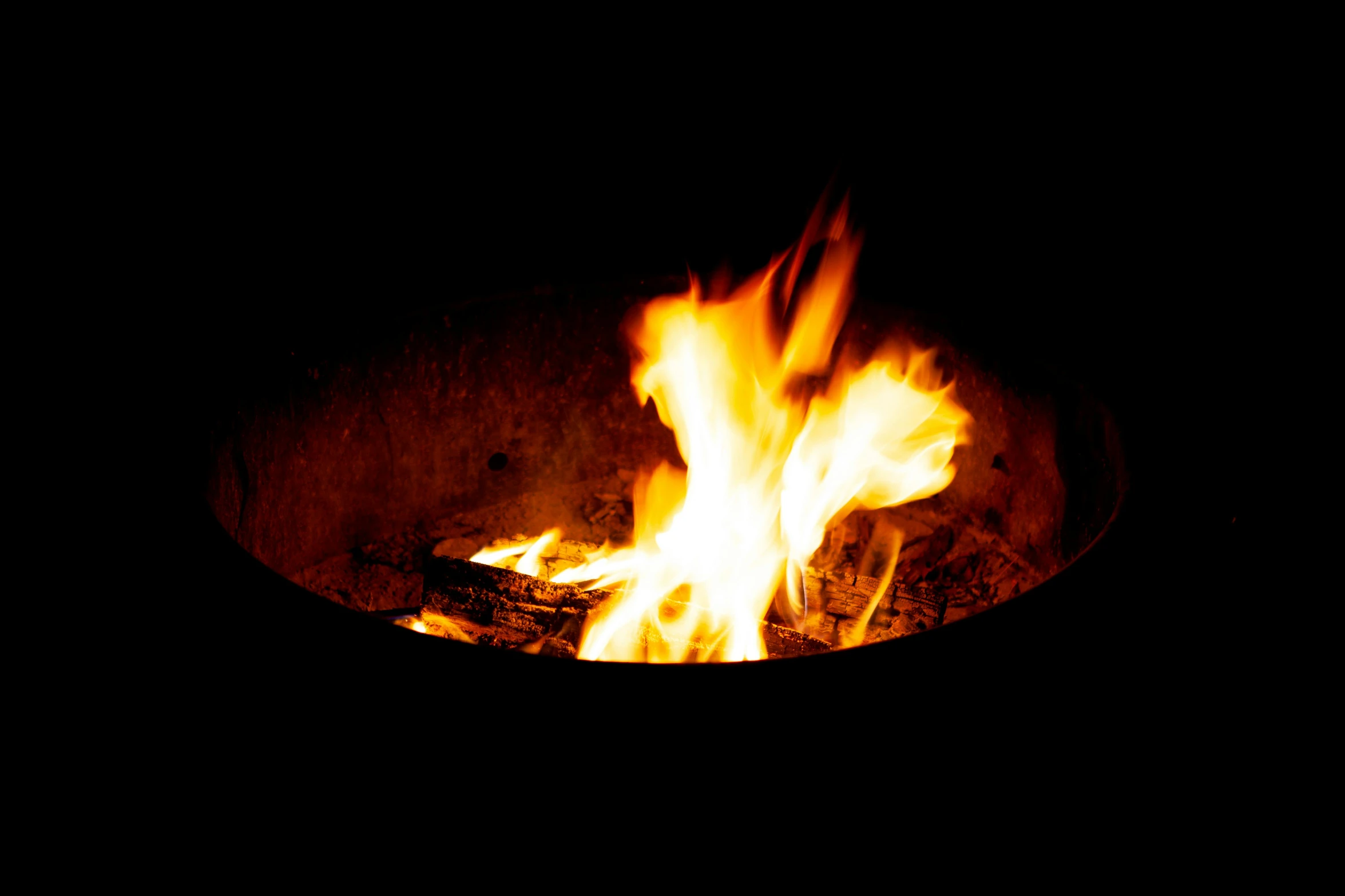 a close up of a fire in the dark, an album cover, pexels, figuration libre, fire pit, avatar image, round-cropped, brown