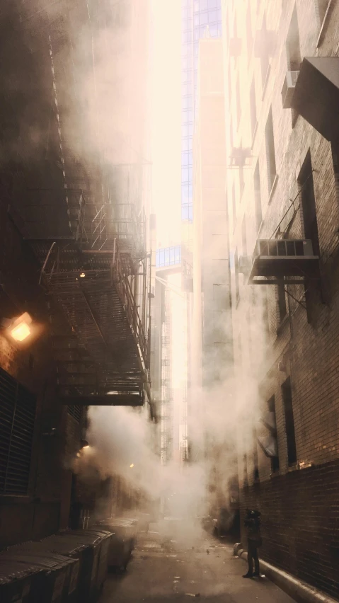 a street filled with lots of smoke next to tall buildings, inspired by Beeple, pexels contest winner, location [ chicago ( alley ) ], live-action archival footage, in an alley, volumetric light and mist