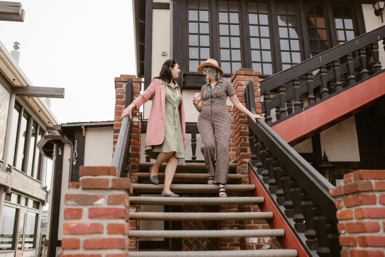 three women walking up a set of stairs, pexels, arts and crafts movement, vintage muted colors, two beautiful women in love, straw hat and overcoat, asian women