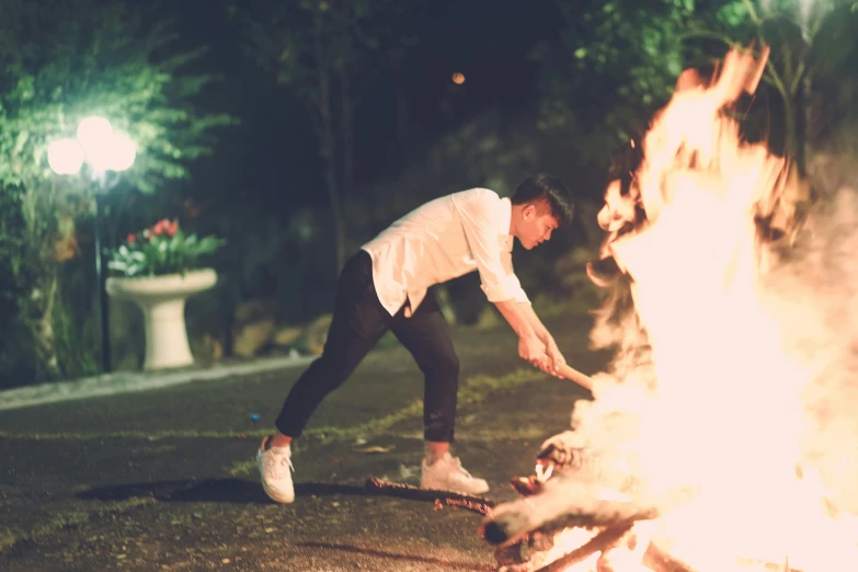 a man that is standing in front of a fire, dancing around a fire, profile image, barbecuing chewing gum, brandon woelfel