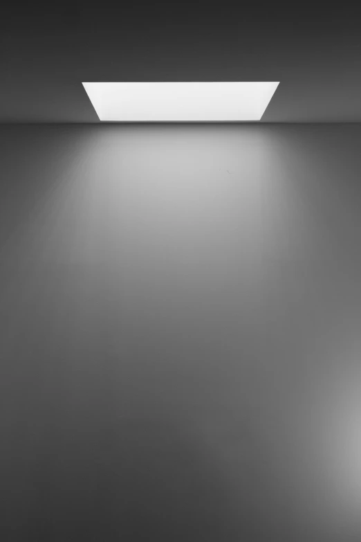 a black and white photo of an empty room, by Leo Leuppi, light and space, top down lighting, unreal with on gradient, recessed, monochrome:-2