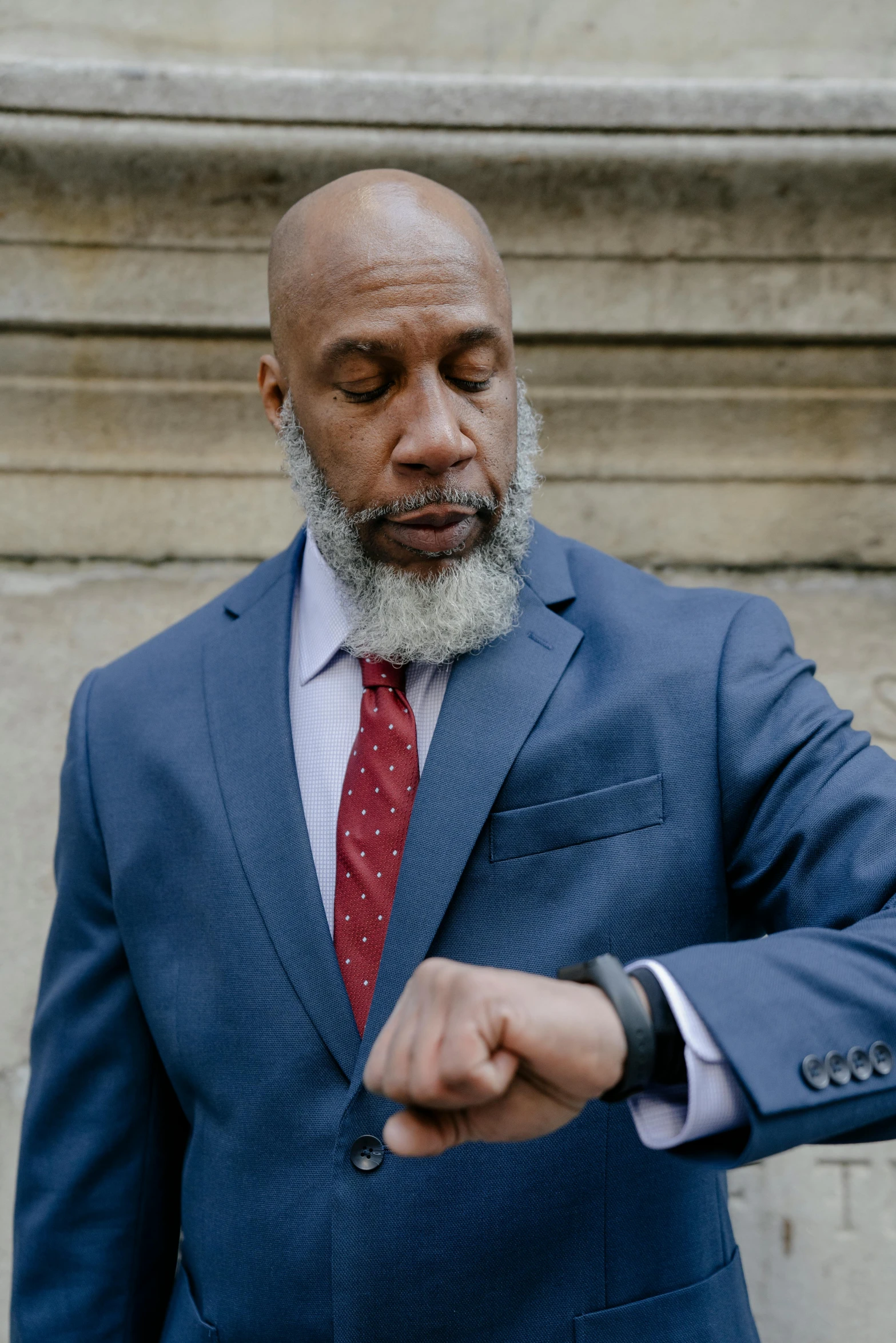 a bald man in a blue suit and red tie, inspired by William H. Mosby, pexels contest winner, renaissance, wears a watch, gray beard, jamel shabazz, wearing a watch