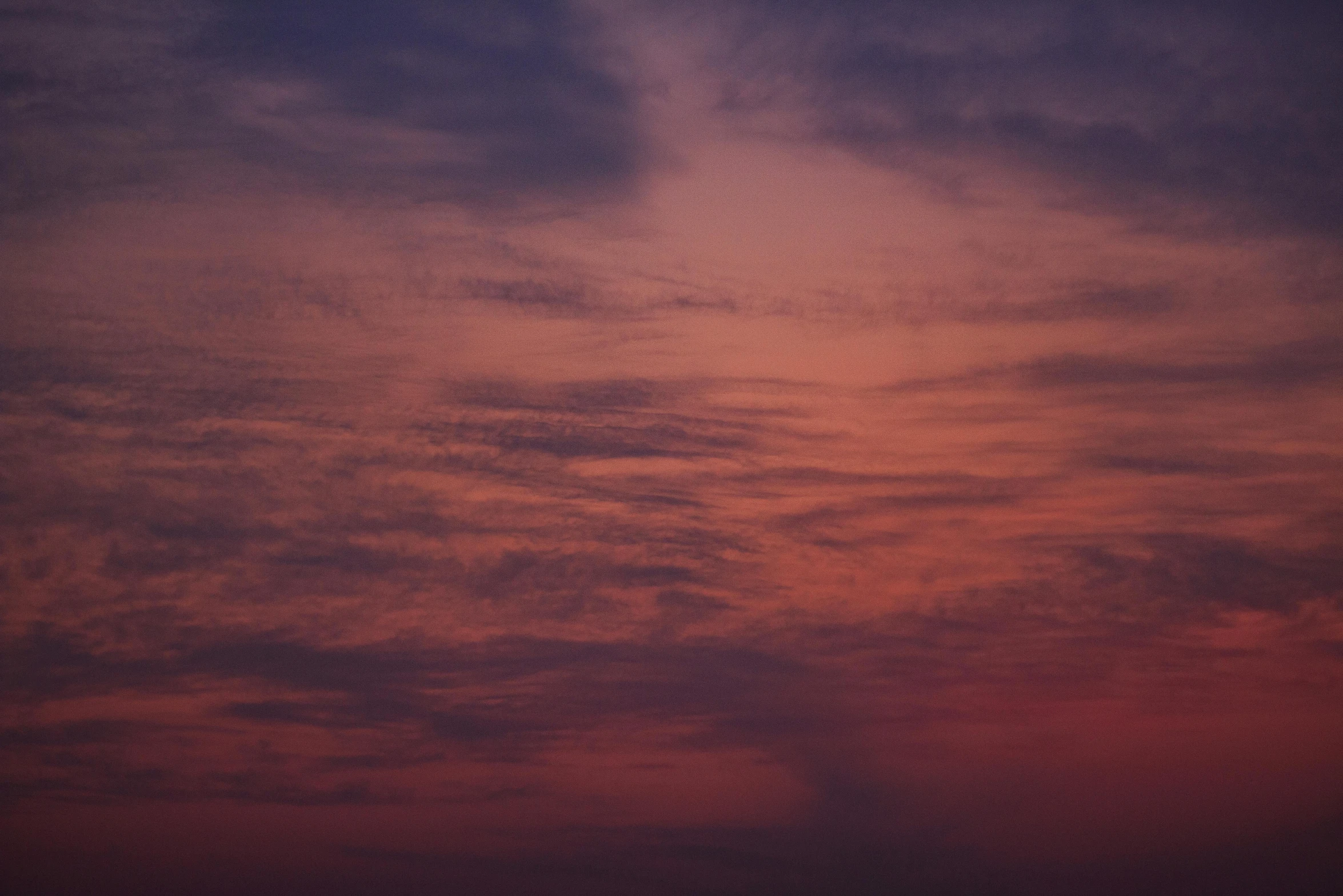 a large body of water under a cloudy sky, an album cover, inspired by Elsa Bleda, pexels contest winner, romanticism, barely lit warm violet red light, red sky blue, major arcana sky, goodnight