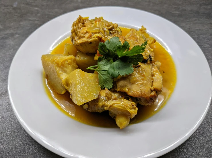 a white plate topped with meat and vegetables, inspired by John Steuart Curry, chicken, detailed product image, yellow, 王琛