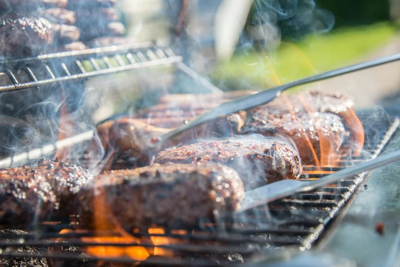 a close up of a grill with meat on it, by Joe Bowler, pexels contest winner, profile image, background image, midsummer, 6 pack