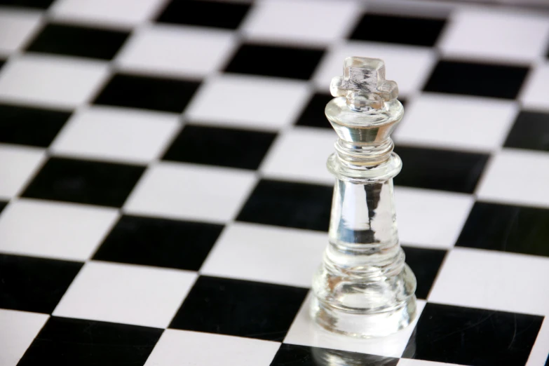 a glass chess piece sitting on top of a checkered floor, crowned, crisp and clear, thumbnail, chesley
