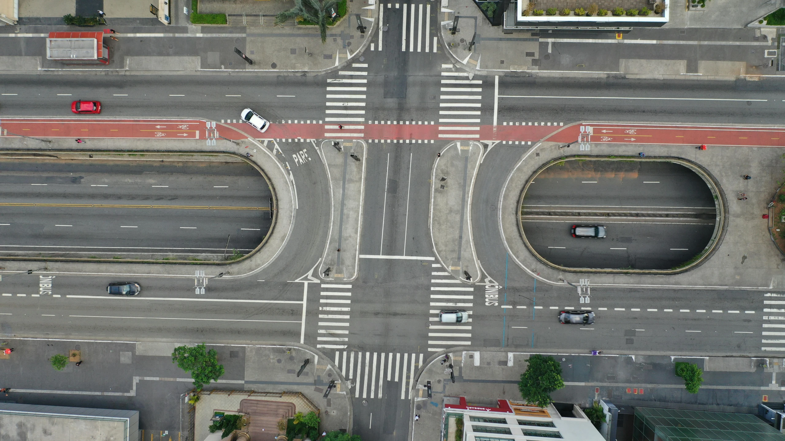 an aerial view of an intersection in a city, unsplash contest winner, photorealism, puerto rico, bilateral symmetry, taken in the late 2010s, square