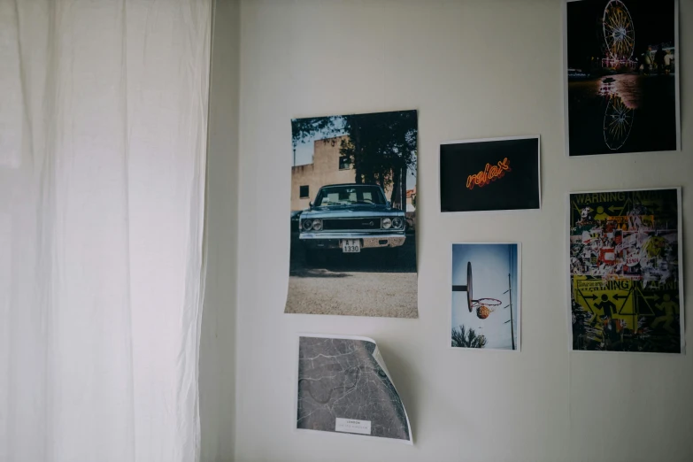 a bed room with a neatly made bed and pictures on the wall, inspired by Elsa Bleda, unsplash, photorealism, inside of a car, photographic print, 90s photo