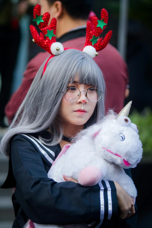 a close up of a person holding a stuffed animal, by Kanbun Master, reddit, wearing silver hair, goat horns on her head, dressed as schoolgirl, 15081959 21121991 01012000 4k