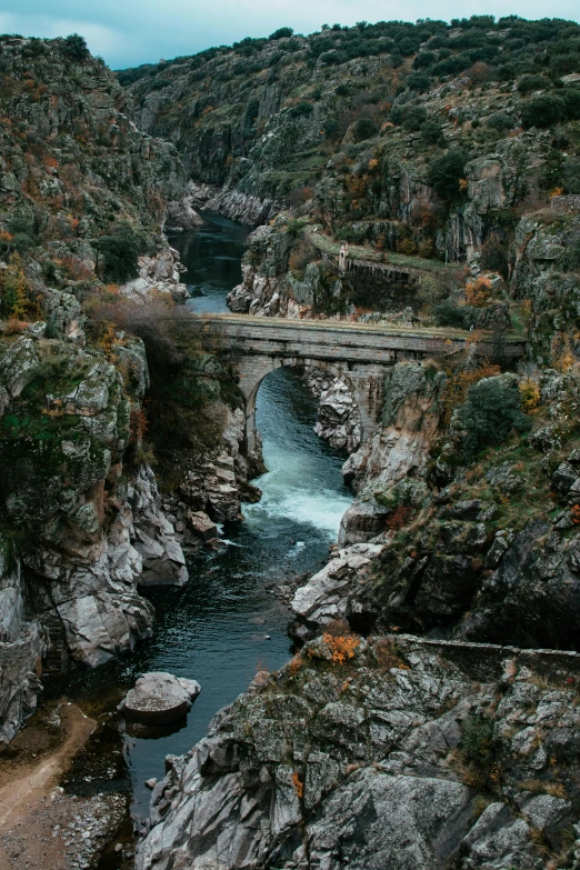 a river running through a canyon next to a bridge, wild water, 2019 trending photo, spain rodriguez, 2 5 6 x 2 5 6 pixels