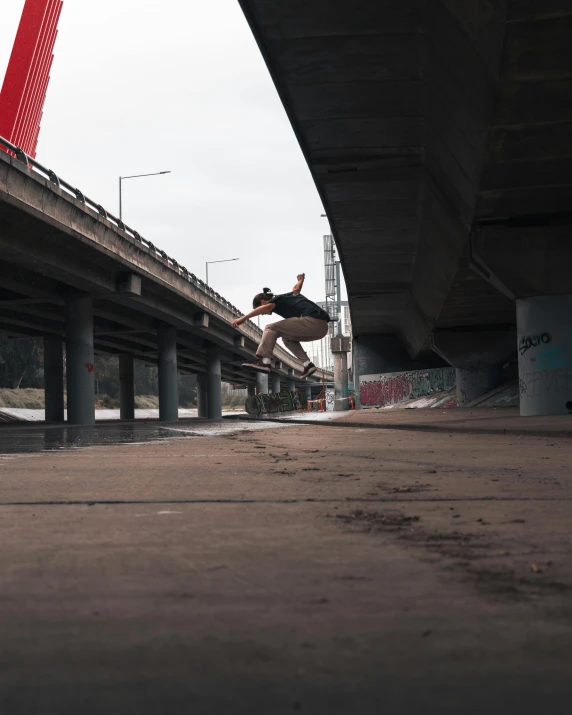 a man flying through the air while riding a skateboard, unsplash contest winner, graffiti, low quality photo, under bridge, movie footage, stacked image