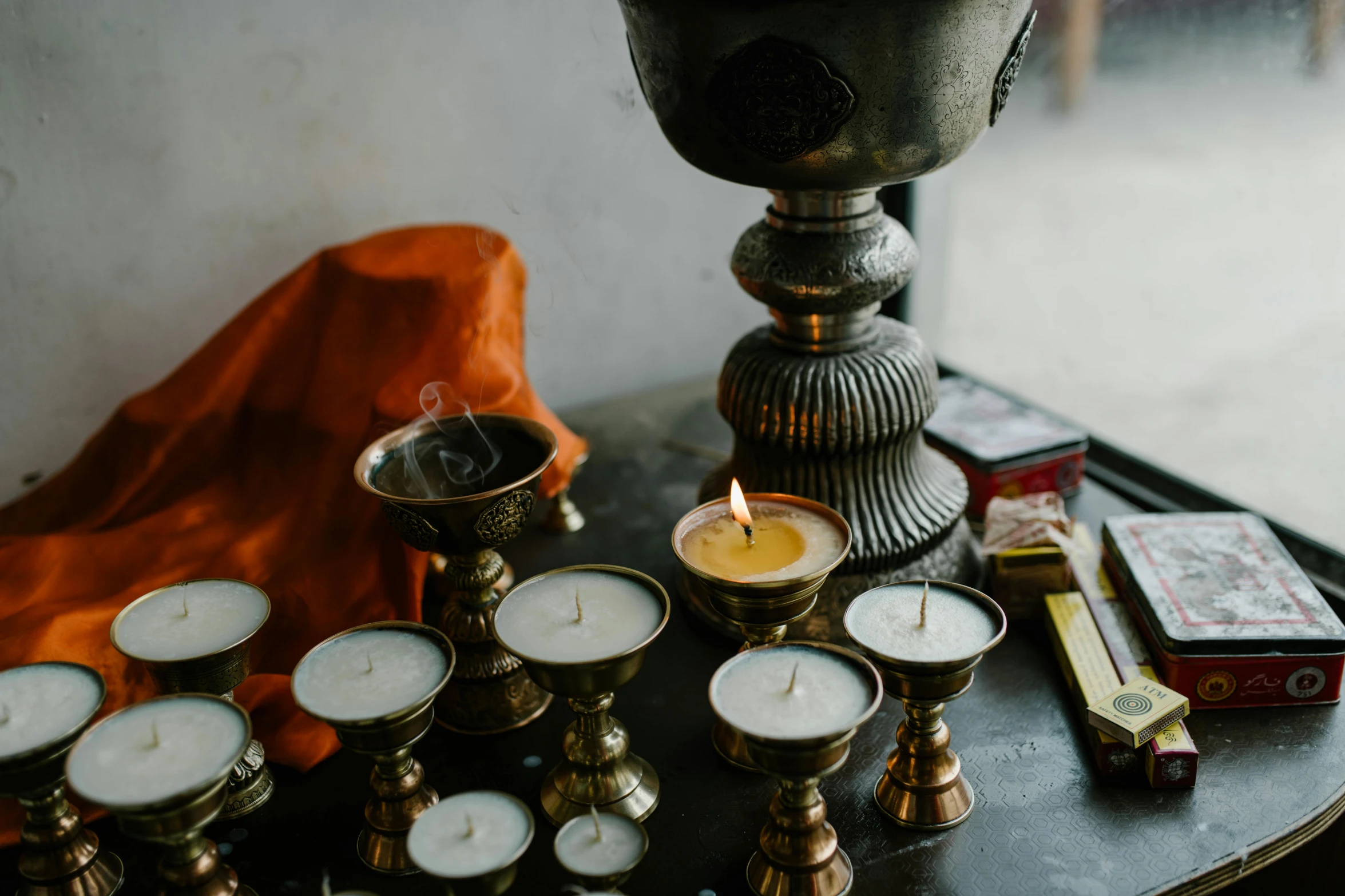 a bunch of candles sitting on top of a table, incense, vessels, india ink, fan favorite