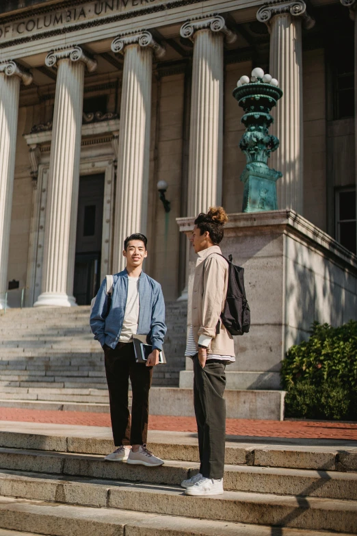 two people standing on steps in front of a building, unsplash, renaissance, asian male, academic clothing, in savannah, ignant