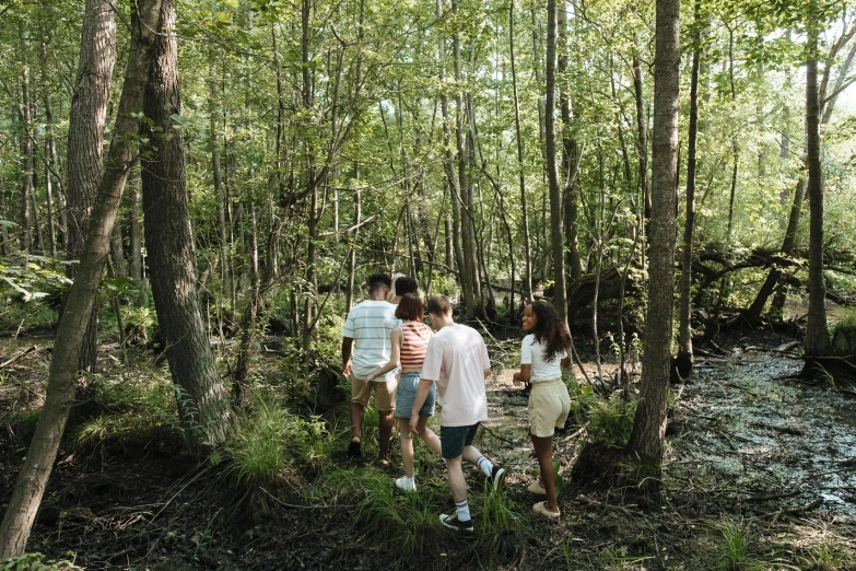 a group of people walking through a forest, by Carey Morris, pexels, renaissance, backwater bayou, boys, 2 0 2 2 photo, promo photo