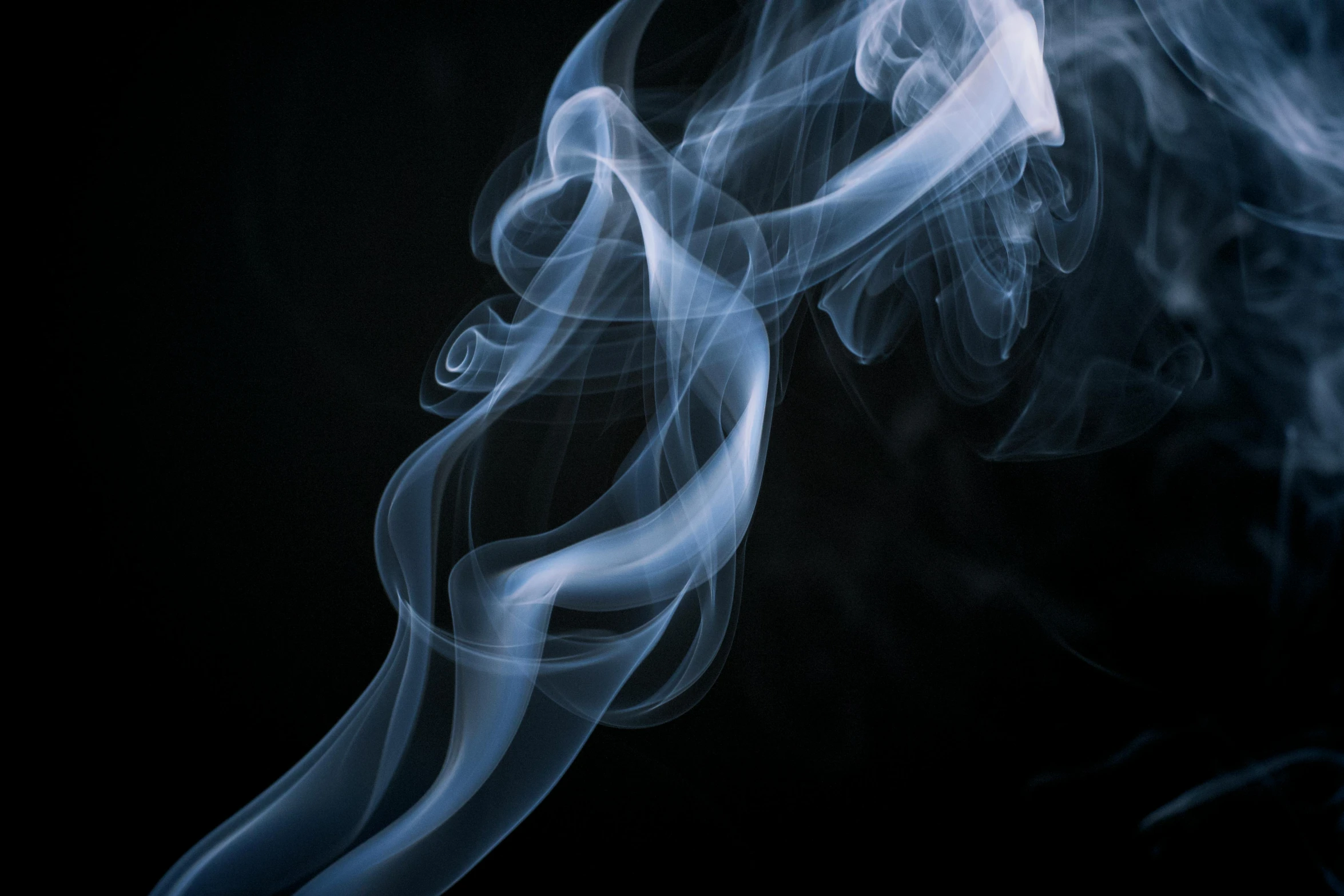 a close up of smoke on a black background, by Daniel Lieske, pexels contest winner, desaturated blue, instagram post, trailing white vapor, praying with tobacco