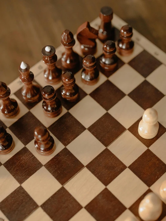 a wooden chess board with chess pieces on it, a jigsaw puzzle, by Adam Marczyński, unsplash contest winner, brown and cream color scheme, thumbnail, anomalisa, ( ( theatrical ) )